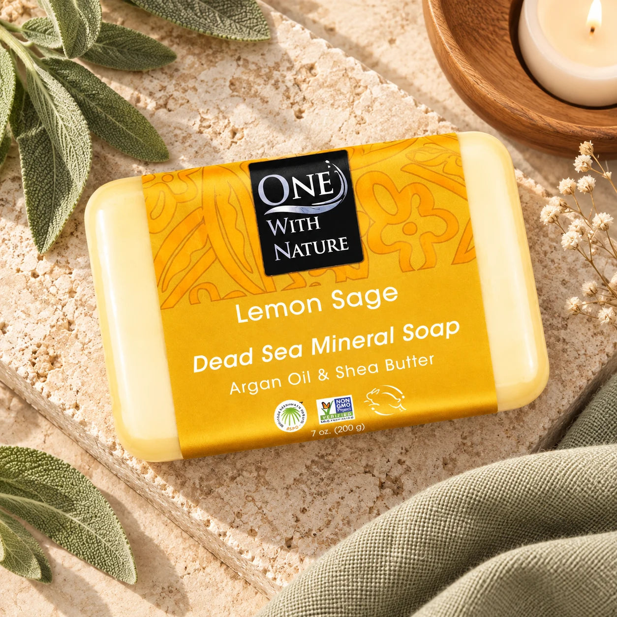 One With Nature Lemon Sage soap in a warm stone setting